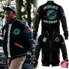 Model wearing the Black Miami Dolphins 2025 Baseball Jacket, alongside detailed front and back views of the jacket's design.