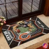 The Chicago Bears doormat featuring a bear mascot and stadium graphic placed on a stone step in front of a glass door.