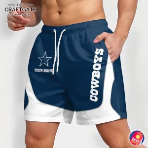 An angled view of the Dallas Cowboys shorts, showing the side text "COWBOYS" and the front logo with custom name option.