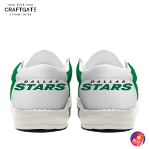 The back view of the Dallas Stars loafer shoes, displaying the "DALLAS STARS" team name printed in green across the white heels.