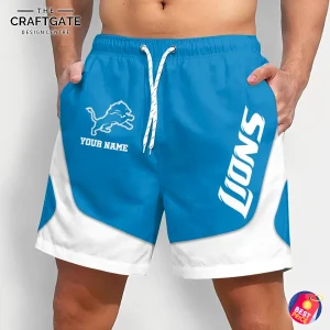 A model wears the custom Detroit Lions shorts, showing the front with the team logo and a "YOUR NAME" placeholder for personalization.