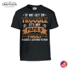 Front view of a black t-shirt with the text "If We Get In Trouble It's My Papa's Fault Because I Listened To Him" in orange and white.