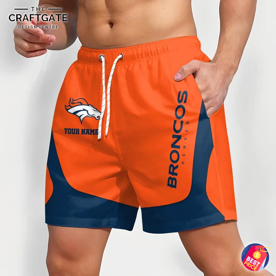Angled View of Personalized Denver Broncos Shorts An angled side view of a man in personalized Denver Broncos shorts, highlighting the vibrant orange and navy blue design.