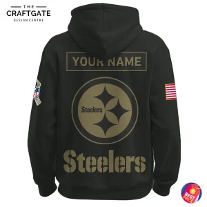 Close-up of the back of the Pittsburgh Steelers Salute to Service hoodie, featuring a large team logo and a 'YOUR NAME' placeholder.