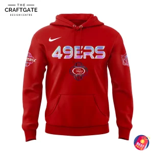 The front of the red 49ers x KPop Demon Hunters hoodie featuring holographic '49ERS' text, the team logo, and sleeve patches.
