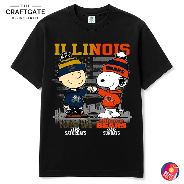 Black t-shirt with Charlie Brown in Notre Dame gear and Snoopy in Chicago Bears gear fist-bumping in front of an Illinois flag.