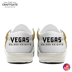 Back view of the Vegas Golden Knights loafer shoes, displaying the "VEGAS GOLDEN KNIGHTS" team name on the white heel of each shoe.