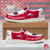 A pair of Washington Capitals loafer shoes in red and white, displaying the side view with "LET'S GO CAPITALS" text and team logo.