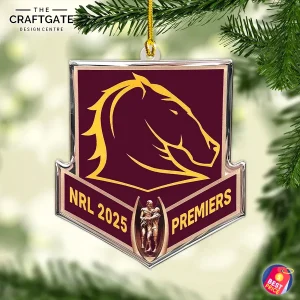 The Brisbane Broncos 2025 Premiers acrylic ornament hanging from a pine branch, showing the team logo and NRL trophy design.