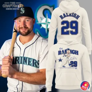 Cal Raleigh of the Seattle Mariners next to the front and back views of an off-white hoodie with his 2025 MVP cartoon design.