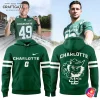A model in a Charlotte 49ers jersey above the green Old Norm Is Back hoodie, showing the front and back designs.