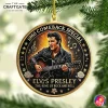 Close-up of the Elvis Presley 1968 Comeback Special acrylic ornament hanging from a lush green Christmas tree branch.
