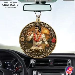 Elvis Presley Aloha From Hawaii acrylic ornament hanging in a car, showing the dashboard, steering wheel, and rearview mirror.