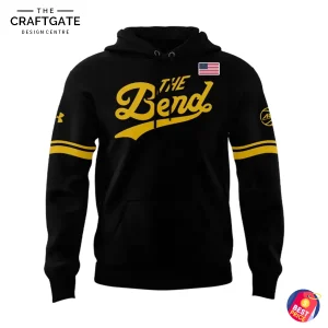Front view of the black Notre Dame The Bend 2025 hoodie, featuring gold script text, an American flag patch, and gold sleeve stripes.