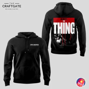 Front and back views of a black hoodie. The front has a small tour logo, and the back features a large graphic from the movie The Thing.