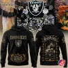 Front and back views of the black Las Vegas Raiders Hasta la Muerte hoodie with Dia de los Muertos-inspired graphics.