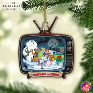 Scooby Doo and Friends acrylic ornament shaped like a retro TV, showing a snowy mystery scene, hanging from a Christmas tree.