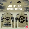 A promotional image showing the front and back of the Minnesota Wild military appreciation hoodie with camo accents.