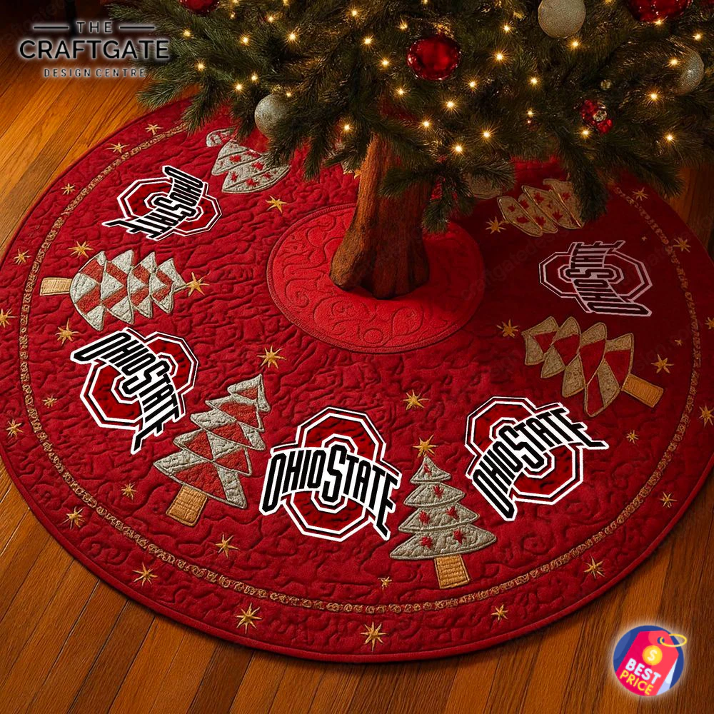 Ohio State Buckeyes Quilted Christmas Tree Skirt with Logos A red quilted Ohio State Buckeyes tree skirt under a lit Christmas tree, featuring team logos and embroidered holiday designs.
