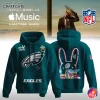 Front and back views of the dark green Philadelphia Eagles x Bad Bunny Super Bowl LX limited edition hoodie with custom graphics.