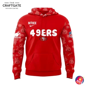 Front of the red 49ers pullover hoodie showing the team name and logo. The sleeves have an all-over Labubu character pattern.
