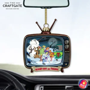 The Scooby Doo and Friends retro TV acrylic ornament hanging from a car's rearview mirror, showing its use as a car charm.