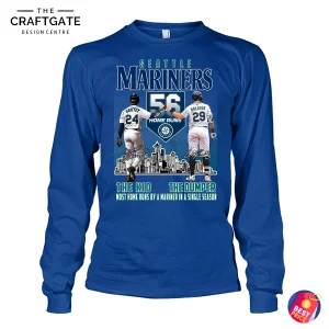 Front view of a royal blue long-sleeve shirt for Seattle Mariners fans, showing the 56 home run design with Griffey and Raleigh.