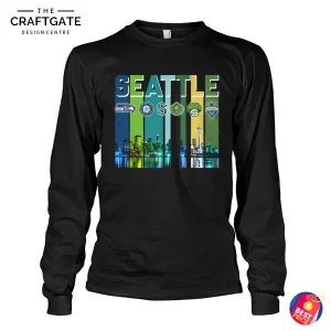 A black long-sleeve t-shirt with a vibrant Seattle sports teams graphic, including the Mariners logo and the city skyline at night.