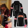 Taylor Swift wearing a custom jacket next to a mockup of the black Kansas City Chiefs pullover hoodie with pink armbands.