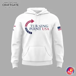 Front view of the white hoodie featuring the red, white, and blue Turning Point USA logo on the chest and an American flag on the sleeve.