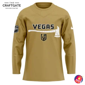 Close-up of the front of the Vegas Golden Knights firefighter jersey, showing the VEGAS text with a firefighter axe graphic.
