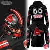 Split collage showing a player in a black WKU helmet with Big Red decal on the left and front/back views of the black Big Red Zombieland hoodie on the right